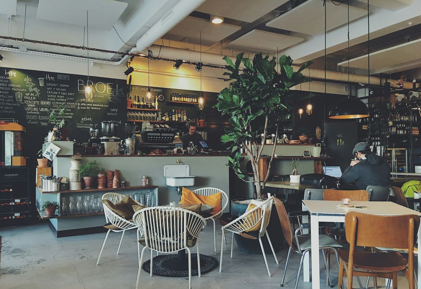Inside Blend Sixty-Six &mdash; chalkboard menu, timber tables and plants