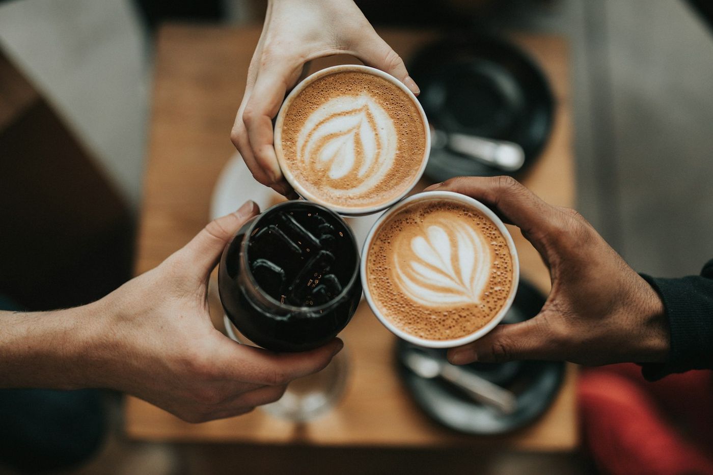 Two latte cups on a table